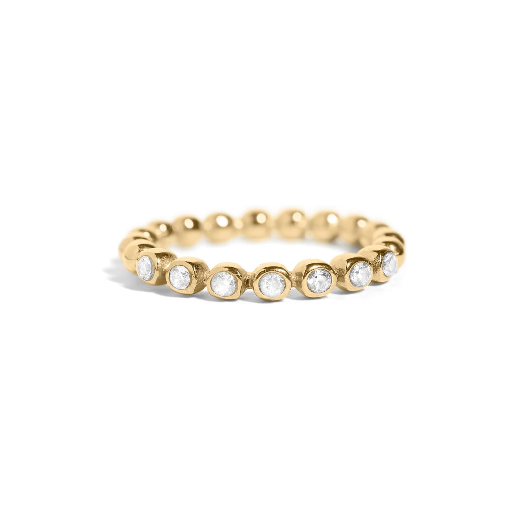 Gold Odyssey stacking ring with bezel-set cubic zirconia